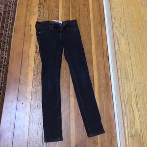 These are dark blue skinny jeans.